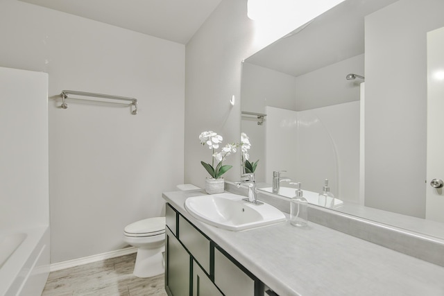 6205 21st St, Lubbock, TX 79407 - bathroom featuring vanity, wood finished floors, and shower / washtub combination