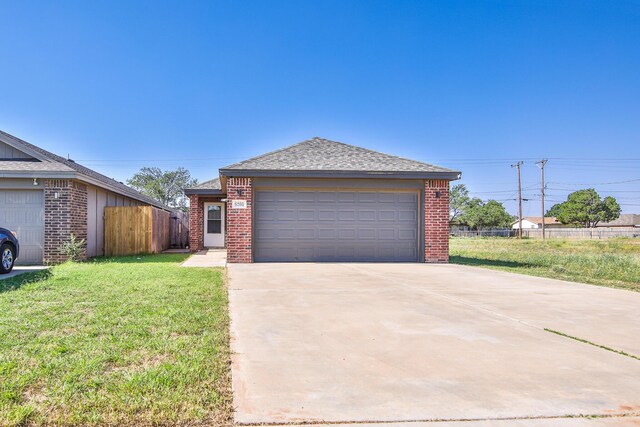 6205 21st St, Lubbock, TX 79407 - ranch-style home featuring brick siding, a garage, and a shingled roof
