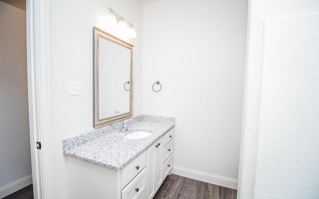 bathroom with vanity and wood-type flooring