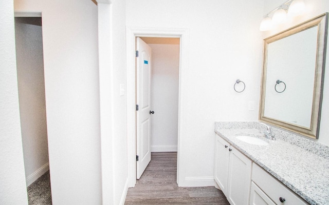 bathroom with vanity and wood-type flooring