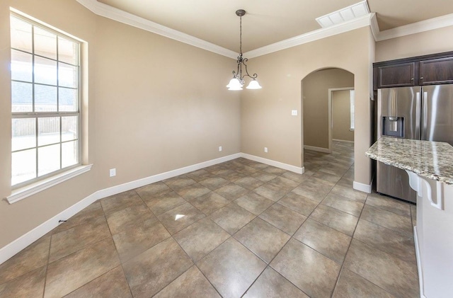 unfurnished dining area featuring an inviting chandelier and ornamental molding