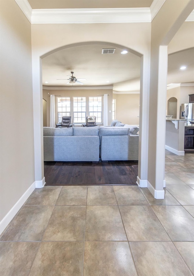 hall featuring ornamental molding