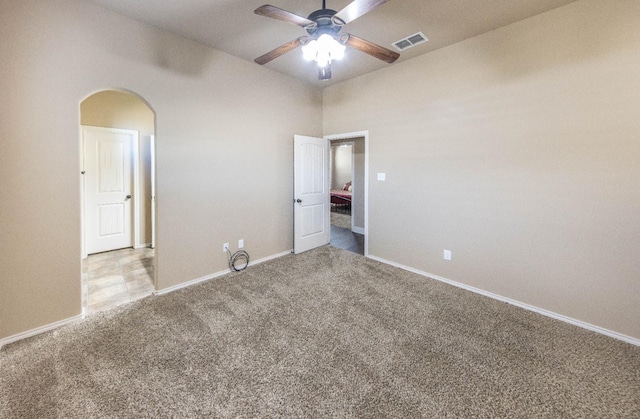 unfurnished bedroom featuring light colored carpet and ceiling fan