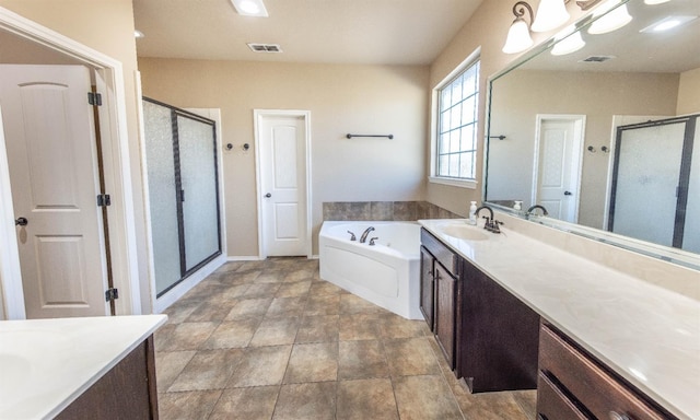 bathroom with plus walk in shower and vanity