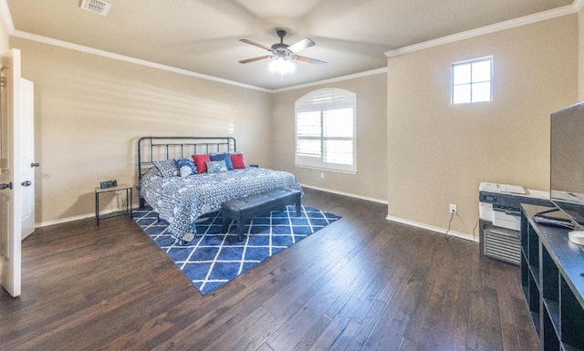 bedroom featuring ornamental molding, dark hardwood / wood-style floors, and ceiling fan