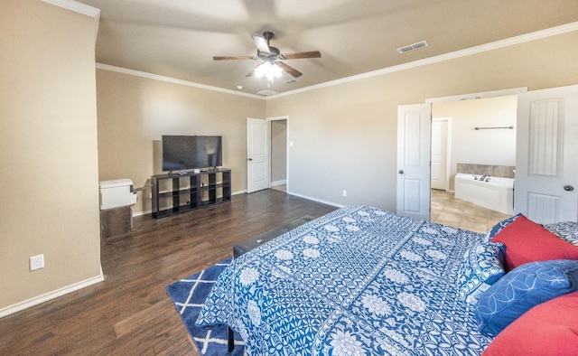 bedroom featuring hardwood / wood-style floors, ensuite bath, ornamental molding, and ceiling fan