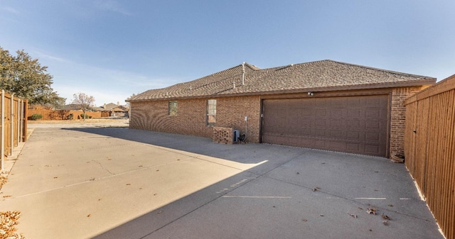 view of side of home featuring a garage