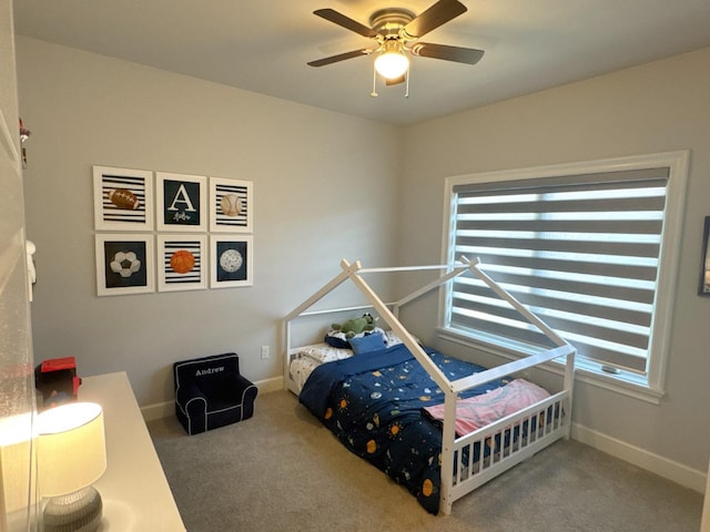 carpeted bedroom featuring ceiling fan