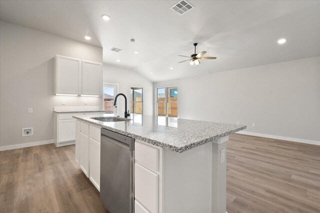 7429 30th St, Lubbock, TX 79407 - kitchen featuring dishwasher, sink, white cabinets, a kitchen island with sink, and light stone counters
