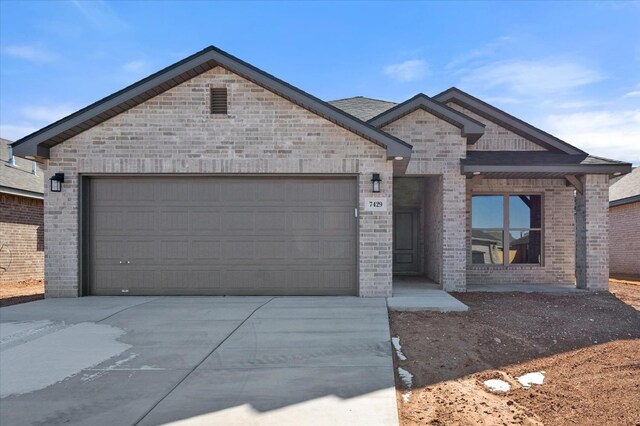 7429 30th St, Lubbock, TX 79407 - view of front facade featuring a garage