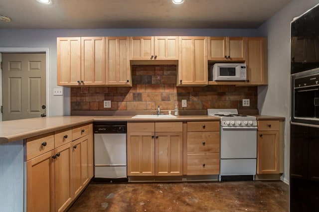 kitchen featuring tasteful backsplash, white appliances, light brown cabinetry, and sink