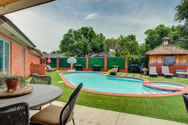 view of pool with a yard, a gazebo, a patio, and an in ground hot tub