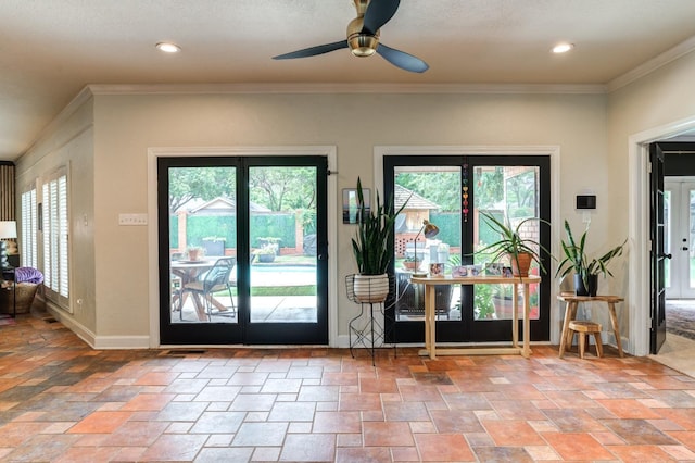 doorway to outside featuring crown molding, ceiling fan, and a wealth of natural light