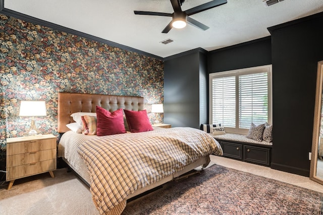 carpeted bedroom featuring crown molding and ceiling fan