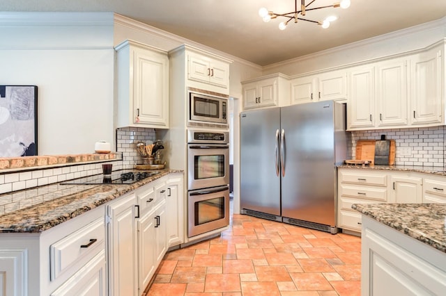 kitchen with white cabinetry, crown molding, stainless steel appliances, light stone countertops, and decorative backsplash