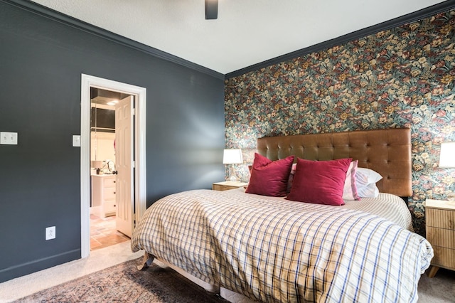 bedroom with crown molding, carpet flooring, ensuite bathroom, and ceiling fan