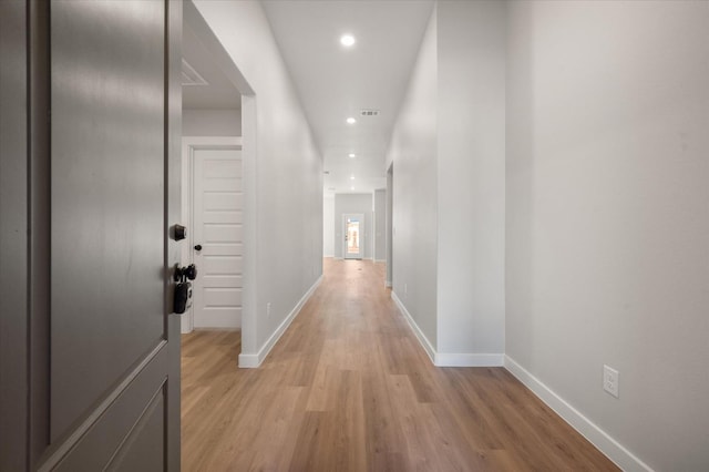 hall with light wood-type flooring