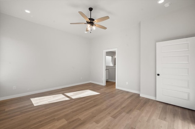 6811 54th St, Lubbock, TX 79407 - unfurnished bedroom with ceiling fan, a walk in closet, and light hardwood / wood-style floors