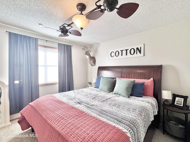 914 W Lee St, Floydada, TX 79235 - bedroom with carpet floors, a textured ceiling, and a ceiling fan