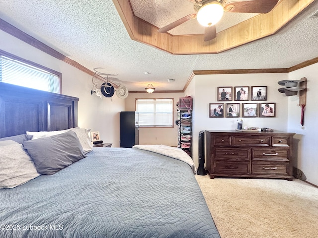 914 W Lee St, Floydada, TX 79235 - bedroom with a textured ceiling, light colored carpet, a ceiling fan, and crown molding