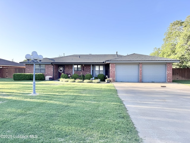 914 W Lee St, Floydada, TX 79235 - ranch-style house with an attached garage, driveway, and brick siding