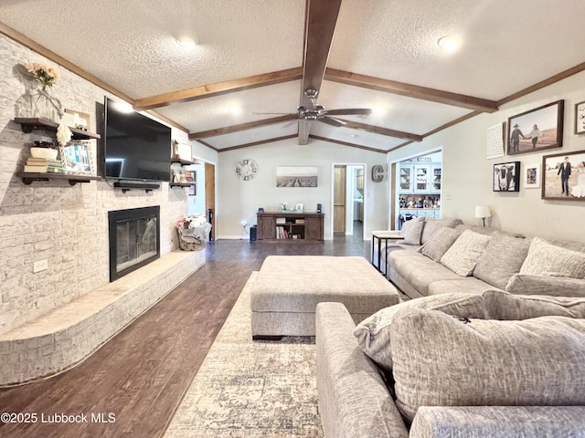 914 W Lee St, Floydada, TX 79235 - living room with a textured ceiling, wood finished floors, a brick fireplace, a ceiling fan, and crown molding