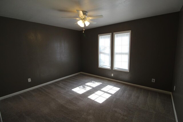 carpeted empty room with ceiling fan