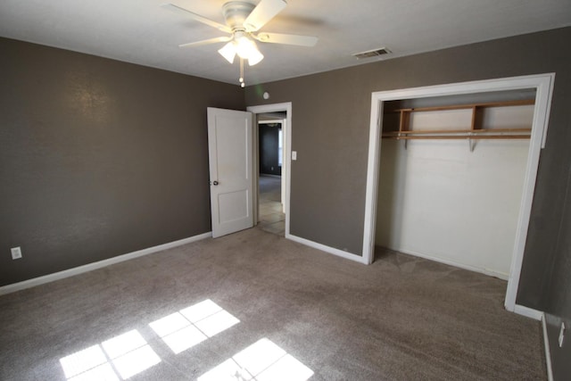 unfurnished bedroom with light carpet, a closet, and ceiling fan