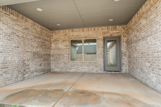 entrance to property featuring a patio