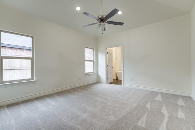 empty room with light carpet and ceiling fan