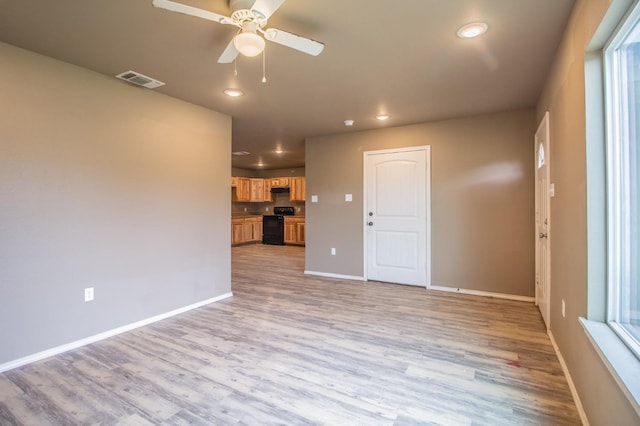 unfurnished living room with light hardwood / wood-style floors and ceiling fan