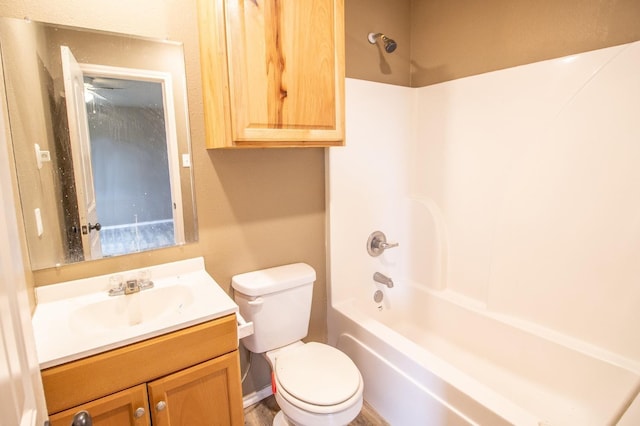 full bathroom featuring shower / bath combination, vanity, and toilet