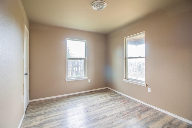 spare room featuring light hardwood / wood-style flooring