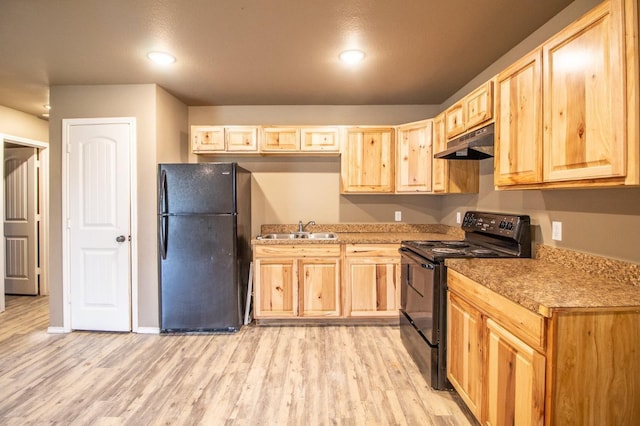 kitchen featuring sink, light brown cabinets, light hardwood / wood-style floors, and black appliances