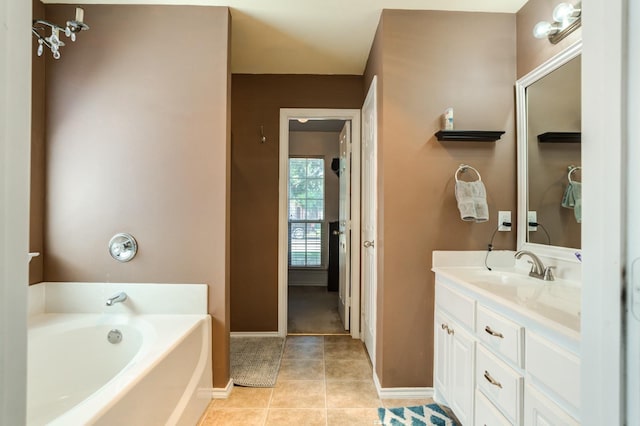 bathroom with vanity, a bath, and tile patterned flooring