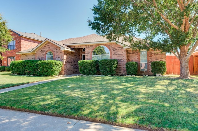 single story home featuring a front yard