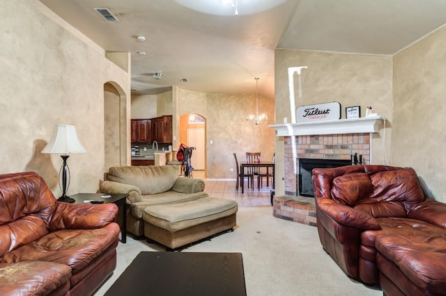 living room featuring light colored carpet, a fireplace, and a chandelier