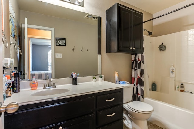 full bathroom with vanity, shower / tub combo with curtain, and toilet