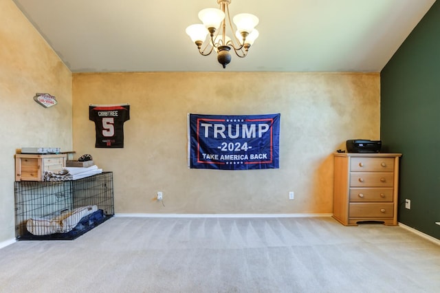 interior space with a chandelier and carpet floors