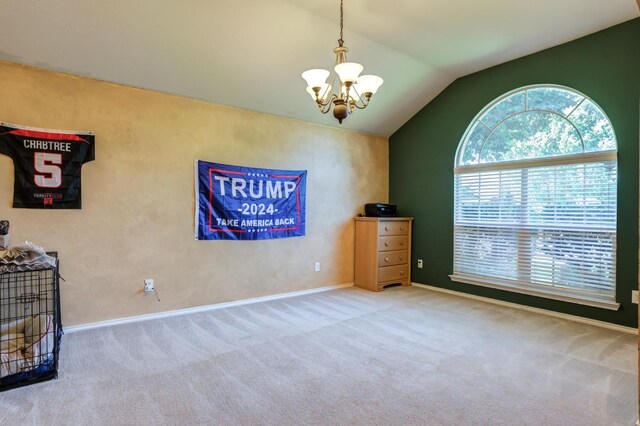 interior space featuring vaulted ceiling, carpet flooring, and an inviting chandelier