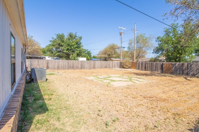 view of yard featuring central AC