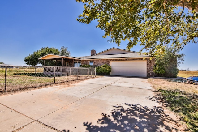 view of front of house featuring a garage and a front yard