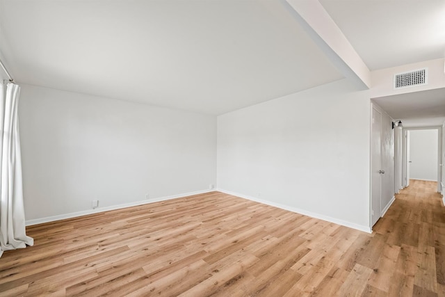 unfurnished room with light hardwood / wood-style flooring