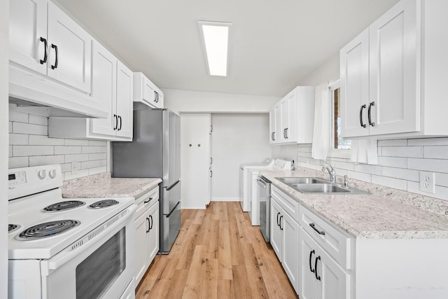 kitchen featuring white cabinetry, appliances with stainless steel finishes, and sink