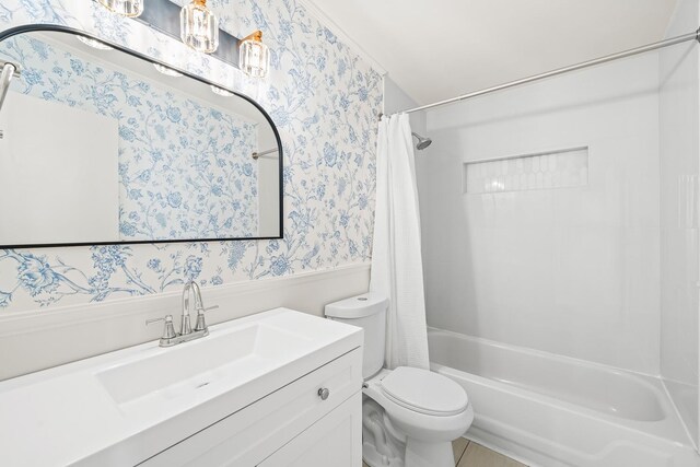 full bathroom featuring vanity, shower / tub combo with curtain, and toilet