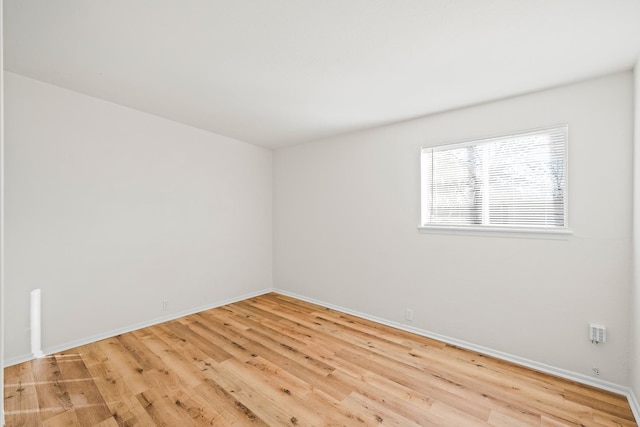 empty room with light wood-type flooring