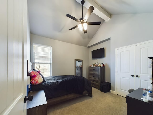 bedroom with light carpet, vaulted ceiling with beams, ceiling fan, and a closet