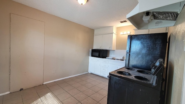 kitchen with white cabinetry, light tile patterned flooring, extractor fan, and black appliances