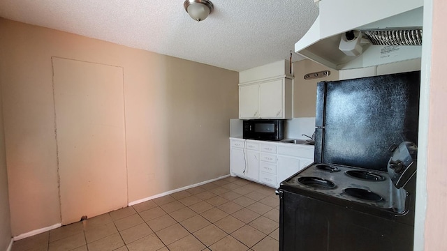 kitchen featuring light tile patterned floors, sink, black appliances, a textured ceiling, and white cabinets