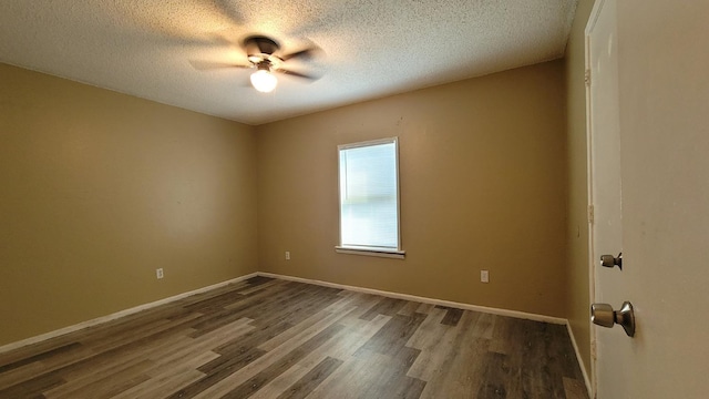 unfurnished room featuring ceiling fan, dark hardwood / wood-style floors, and a textured ceiling